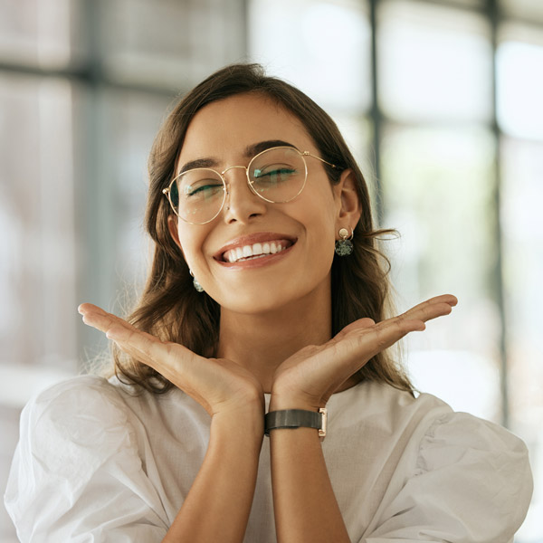 person with hands by face