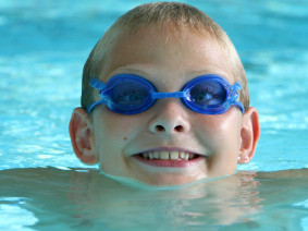 small boy swimming